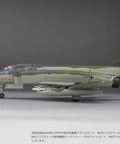 Side view of a 1/72 Luftwaffe F-4F Fighter JG71 Richthofen Hangar-Ready DIY Unpainted Plastic Model Kit FX06 plane on display.