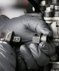 Mechanic using Pinless Universal Swivel Impact Socket Set, 10-Piece Metric, 3/8 Inch Drive, on an engine fastener