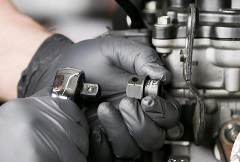 Mechanic using Pinless Universal Swivel Impact Socket Set, 10-Piece Metric, 3/8 Inch Drive, on an engine fastener