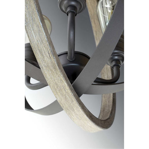 Close-up of Conestee Mini Pendant Light in Graphite Black with Weathered Gray Accents, armillary frame and bulb holder detail