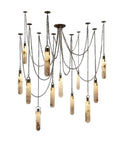 Sleek 12 Light Alabaster Pendant Lamp With Cylinder Shade And Killer Led Glow For Modern Dining Rooms across varying lengths in a rugged steel mount.