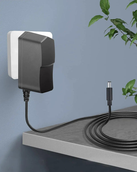 Universal 12V 1A Power Adapter With Dual Barrel Plug 5.5x2.1mm And 2.5mm, 6ft Cord, plugged into a wall socket