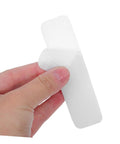 100 Pack Double Sided Hook And Loop Strips With White Pet Film Backing 2.5x10cm Self Adhesive Heavy Duty Fastener Tape For DIY Mounting On Glass Or Metal Walls No Nails Required Strong Hold, being held in hand.