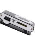 Close-up of Go To Pocket MP3 Player For On The Go Tunes showing USB port and memory card slot, clip-on design, lightweight black.