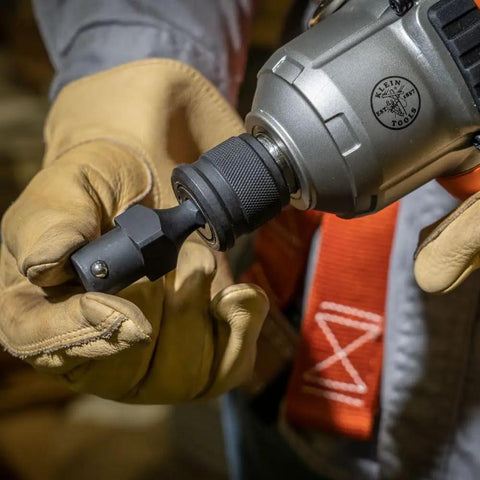 Worker using NRHDA Hex Quick-Change Socket Adapter For NRHD, 7/16-Inch, Rust-Resistant Black Finish on impact driver