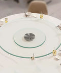 Round Lazy Susan Tempered Glass Turntable Runs Buttery Smooth Heavy Duty Slick Construction Crystal Clear Finish Total Game Changer For Family Dinners And Modern Kitchen Tables 35 To 39 Inches Wide on a dining table.
