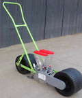 Easy To Use Garden Seed Spreader Handheld Manual Seeder for peanut, corn, and bean planting, portable and durable with wheels