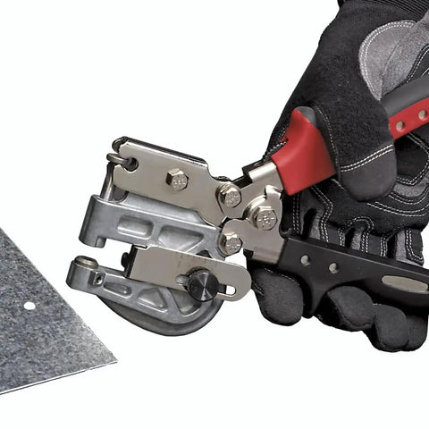 Hand using Heavy Duty Metal Hand Punch Kit With Interchangeable One Eighth And Three Sixteenth Inch Punches on sheet metal
