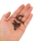 Hand holding brass cylinder concealed hinges 5mm thick barrel hinges heavy duty bulk 10 pack for wooden boxes jewelry boxes and home furniture projects