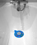 Slick Silicone Bathtub Drain Stopper, Hella Leak Proof Tub Cover, BPA Free Sink Plug in blue with marine designs placed in a bathtub.