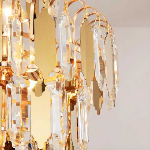 Close-up of crystals on the Lit Gold Finish Modern Crystal Chandelier, 5-Tier 7-Light Round Pendant Ceiling Light With Adjustable Chain