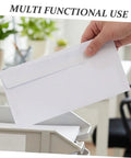 Hand holding White Pro-Grade Self-Sealing Security Mailing Envelopes 115mm X 225mm Confidential Business Letter Size