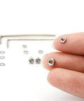 Close-up of nuts from 50 Piece Turntable Headshell Mounting Hardware Kit Stainless Steel Hex Socket Head Screws Bolts Nuts Washers And Wrenches In A Mixed Box Case Color Silver For Phonograph Parts Ready To Install
