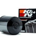 KN High Performance Oil Filter for Big Twin 20W50 Power Pack Oil Kit, black wrench-off filter beside packaging box