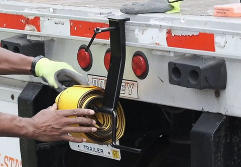 Strap Winder For Flatbed Trailer Black Powder Coated Steel Cargo Tie Down Ratchet Strap Winder Winch Roller in use on a truck