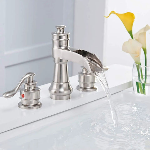 Brushed nickel widespread bathroom faucet with waterfall flow, 8 inch centers, 2 handles, and pop-up drain assembly.