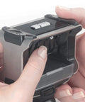 Hands adjusting the Top Shelf Self Inking Date Stamp With Custom Text And Up To Four Lines for easy document stamping.