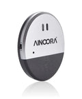 Four Pack Window Alarm Set With 130dB Glass Break Sensor And Vibration Alarm For Homes, Offices, Apartments, And RVs Ultra Slim Easy Install Ideal For Quick Setup And Maximum Deterrence No Wires Needed Instant Alerts. Round AINOORA window alarm, silver and black plastic, side view.