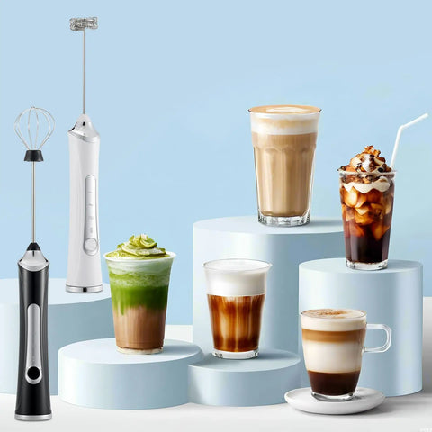 Handheld Milk Frother With Dual Heads USB Rechargeable With 3 Speeds, Coffee Foam Maker And Egg Whisk For Latte Cappuccino Hot Chocolate, Stainless Steel Blades, Black, shown with various coffees on pedestals.