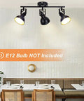 Flexible Ceiling Track Lighting Kit 4-Light Black Track Fixture With Adjustable Swing Arms over restaurant table