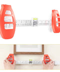 Hustle Free Picture Hanging Tool Combines Spirit Level Tape Measure And Magnetic Nail Starter For Dang Precise Frame Mirror Alignment in use.