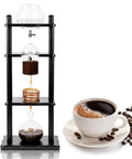 No Fuss Slow Drip Cold Brew Coffee Maker With Heavy Glass Carafe And Natural Wood Tower For Ice Coffee Extraction 1000Ml Capacity Brews Five Complete Cups Straight Up Best For Lazy Chill Weekends on a countertop.