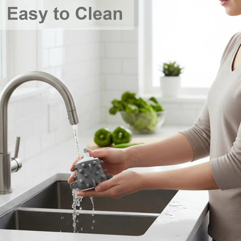 Person washing Garlic Peeler Attachment For Cylindrical Electric Meat Grinders under a kitchen tap, displaying easy cleaning