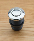 Chrome Touch Activated Garbage Disposal Air Switch Kit on wood surface, fits one and three eighths inch sink hole or countertop island