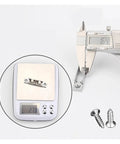Digital scale measuring with screws nearby, showcasing Heavy Duty Zinc Alloy Sliding Door Pulleys With Double Wheel Track Rollers.