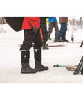 Mens Arctic Sport Tall Winter Boots In Black Featuring Heavy Duty Built Tough Outsole And Dang Snug Fleece Interior worn on snow.