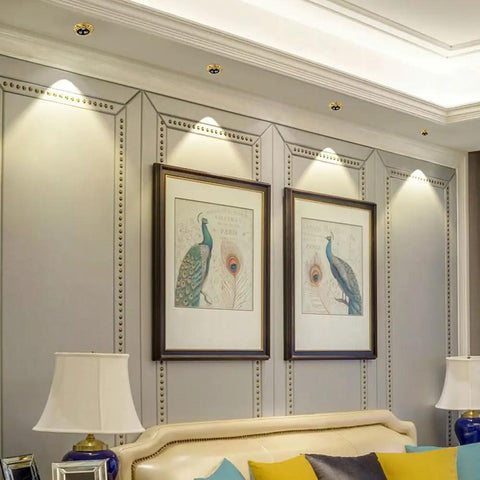 Sleek 4.5 Inch Adjustable Eyeball Led Recessed Ceiling Lights highlighting artwork in a stylish interior setting.