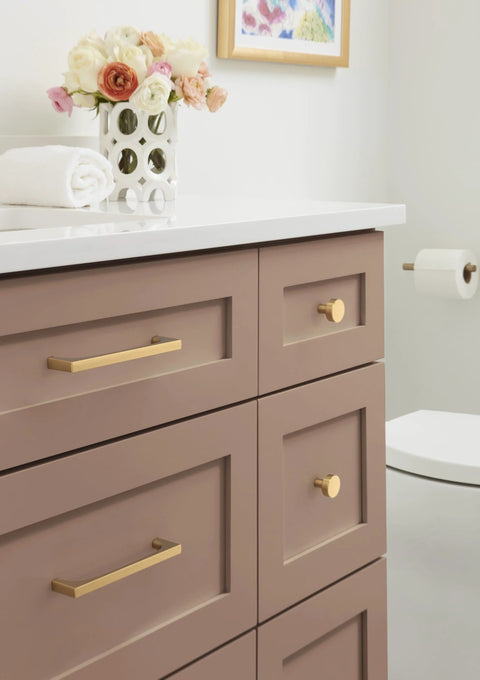 Merced 6-5/16 Inch Center To Center Champagne Bronze Cabinet Pull on drawer in modern bathroom setting