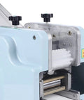 Hella Fast Automatic Dumpling Skin Maker Whips Up Ravioli Sheets And Pasta Dough Presser close-up of machine controls and rollers.