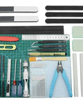 Dope 38 Piece Model Tools Kit For Gundam And Car Models with sandpaper, cutters, files, tweezers, and cutting pad on display