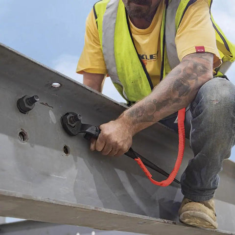 Worker using Workhorse Construction Spud Wrench With Tether Hole Made In USA 1-1/4 Inch Opening 3/4 Inch Bolt Fit Forged Steel Tool on metal beam
