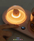 Smart Cup Warmer Heating Pad With Adjustable Temperature Controls features a glowing dome and touch controls for hot beverages.