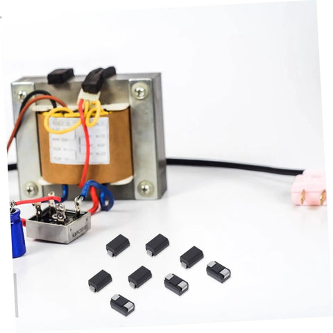 Hella Reliable 100 Piece SMD Rectifier Diode Pack Built Tough For High Voltage Circuits on a workbench with electronic components.