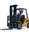 Mini Warehouse RC Forklift Model 9925 With Realistic Light And Sound Effects Precise Steering Lift Lower Function Plus Remote Control Operation For Indoor Play, front view showing lift forks and detailed design.