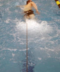 Swimmer using Long Belt Slider Swim Resistance Belt Red For In Pool Training 12 To 31 Lbs In Water Swim Tubing Trainer in pool