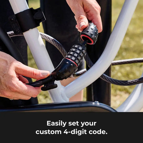 Hands setting a 4-digit combination on a Bike Cable Lock 6 Feet By Half Inch With Resettable Four Digit Combination And Black Vinyl Coating