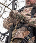Hunter securing 9 ft rope style tree strap for hunting safety, durable rope attachment for quick climb and secure tree connection.
