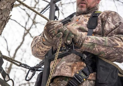 Hunter securing 9 ft rope style tree strap for hunting safety, durable rope attachment for quick climb and secure tree connection.