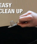 Hand holding 2 Inch Mesh Bathroom Sink Strainer In Stainless Steel For Lavatory Drains Hair Catcher over trash bin