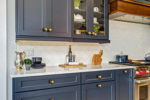 Antique Brass Cabinet Knobs 6 Pack Zinc Alloy Drawer Pulls for kitchen cabinets with blue finish in modern kitchen.