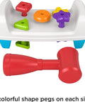 Toddler Tap And Turn Tool Bench Play Set For Tiny Tot Builders with colorful pegs and red hammer, Fisher-Price.