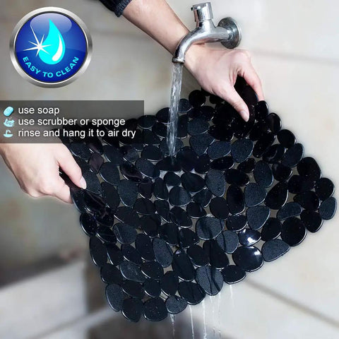 Pebble Kitchen Sink Mats Set Black 2 Pack PVC Sink Protectors being rinsed under faucet, easy to clean