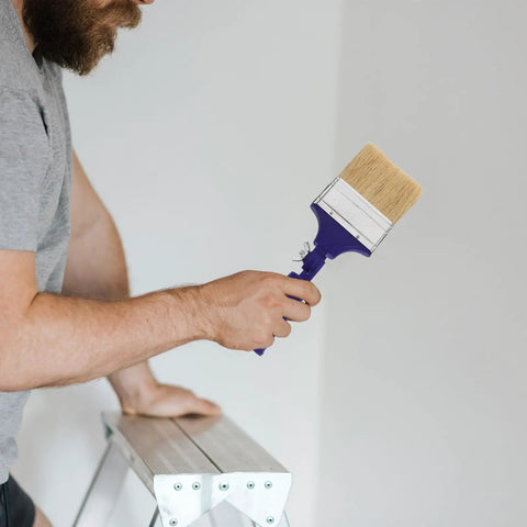 Man using adjustable 3 inch paint brush with 270 degree angled head and 2.6 cm aperture for walls, furniture, deck and acrylic projects.