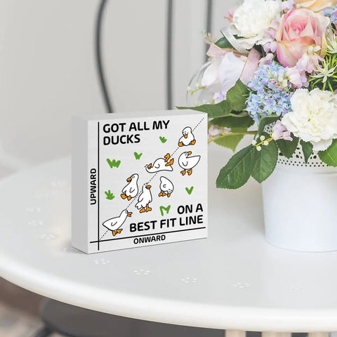 Funny Math Duck Wooden Box Sign Gift For Teachers And Math Nerds, 5x5 inches, on a table with flowers in background.