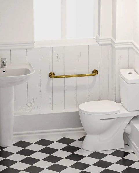 20 Inch Bronze Shower Grab Bar With Anti Slip Knurled Grip Antique Brass Finish mounted in a bathroom near toilet and sink