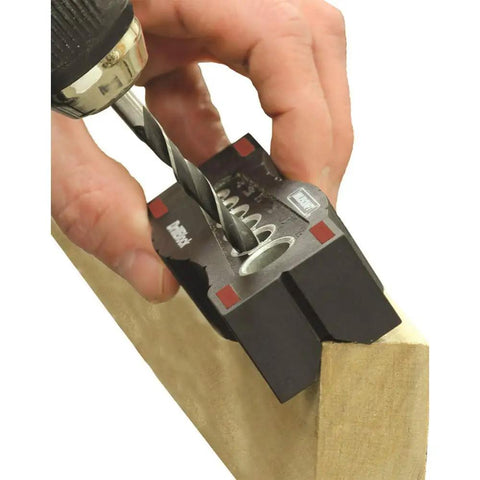Using Pro Grade DrillBlock Drilling Guide for precise hole in wood with solid metal drill jig, six diameters, V-grooves, nonslip grip.